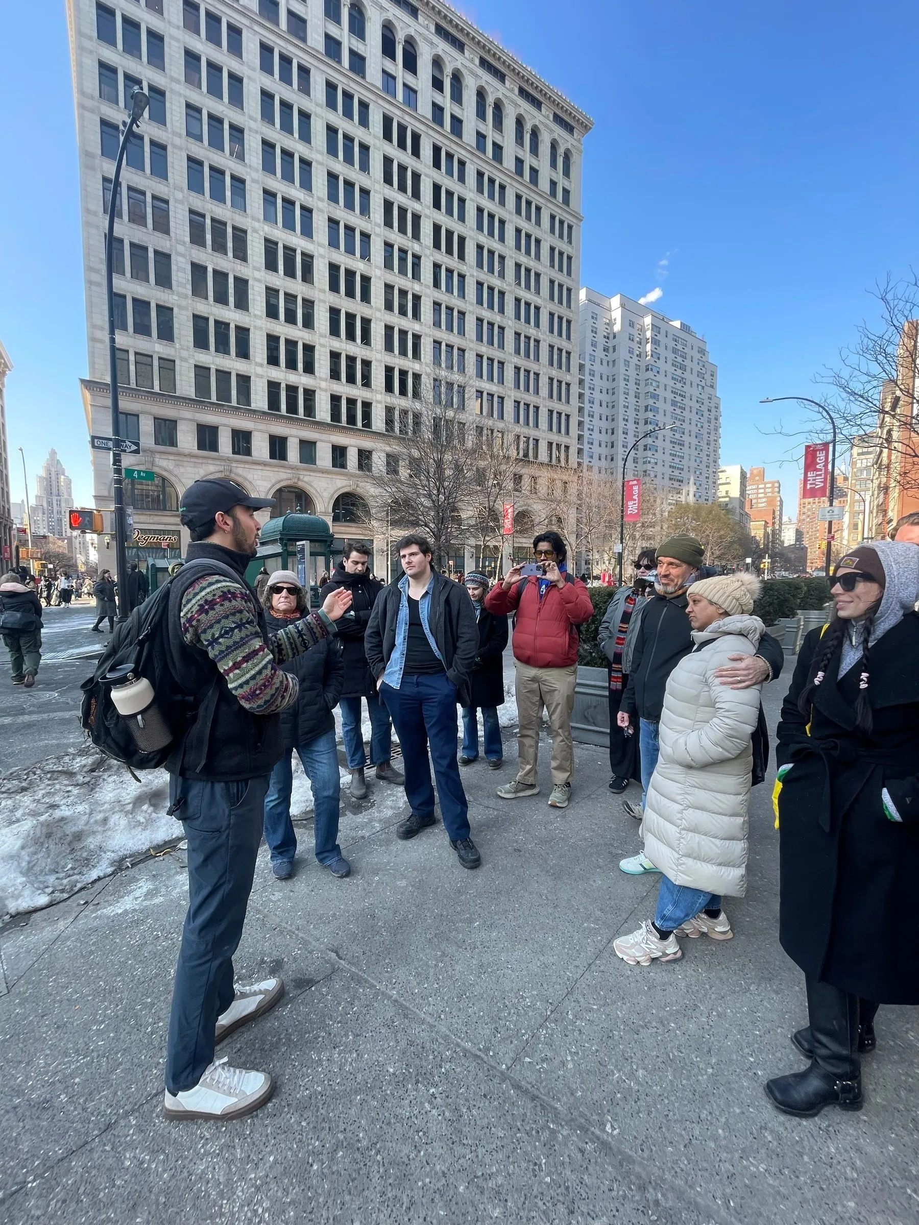 Alex leading a walking tour group near Union Square on a clear winter day